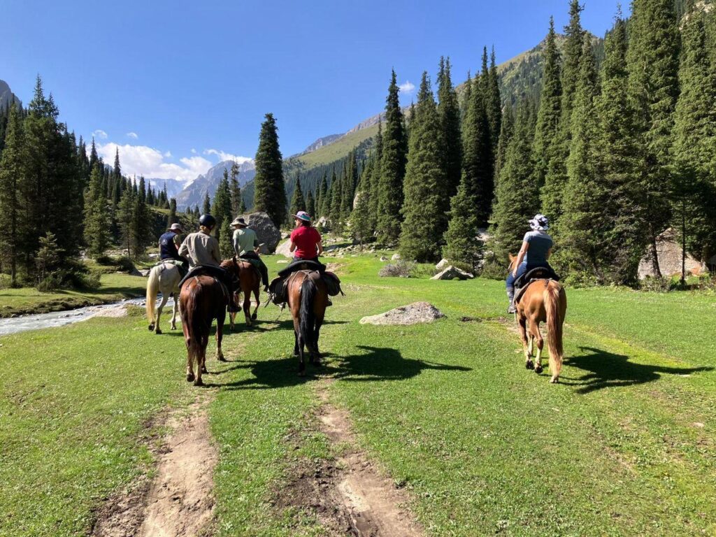Horseback riding in Kyrgyzstan, in an open group with a local agency
